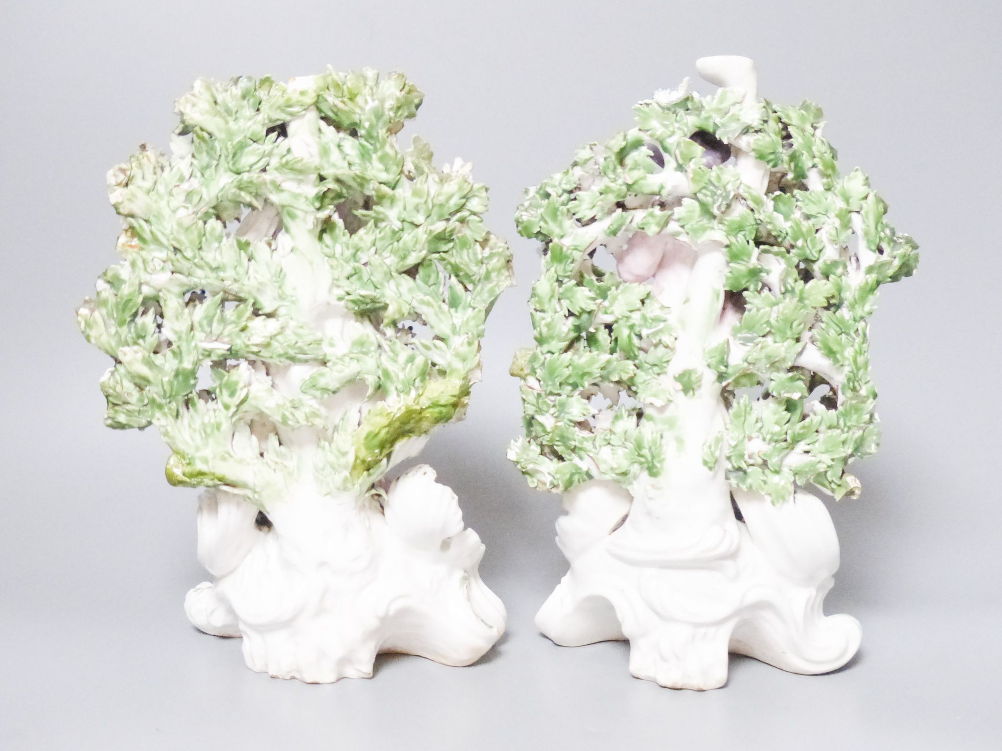 A pair of Derby bocage figures, c.1775, patch marks, 24.5 cm high, damage